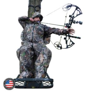 Man bow hunting with premium cold weather hunting suit